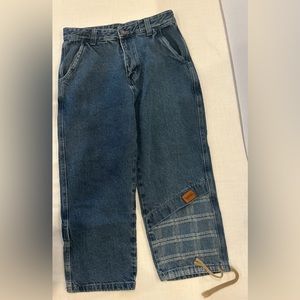 Blue jeans with plaid detail